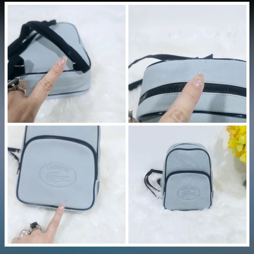 Lacoste mini backpack in a soft light blue shade with navy blue trim accents.